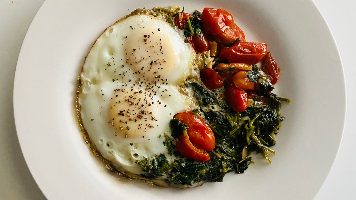 Fried eggs over wilted spinach