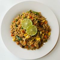Plate of fried rice with lime — photo by I Own My Food Art on Pexels