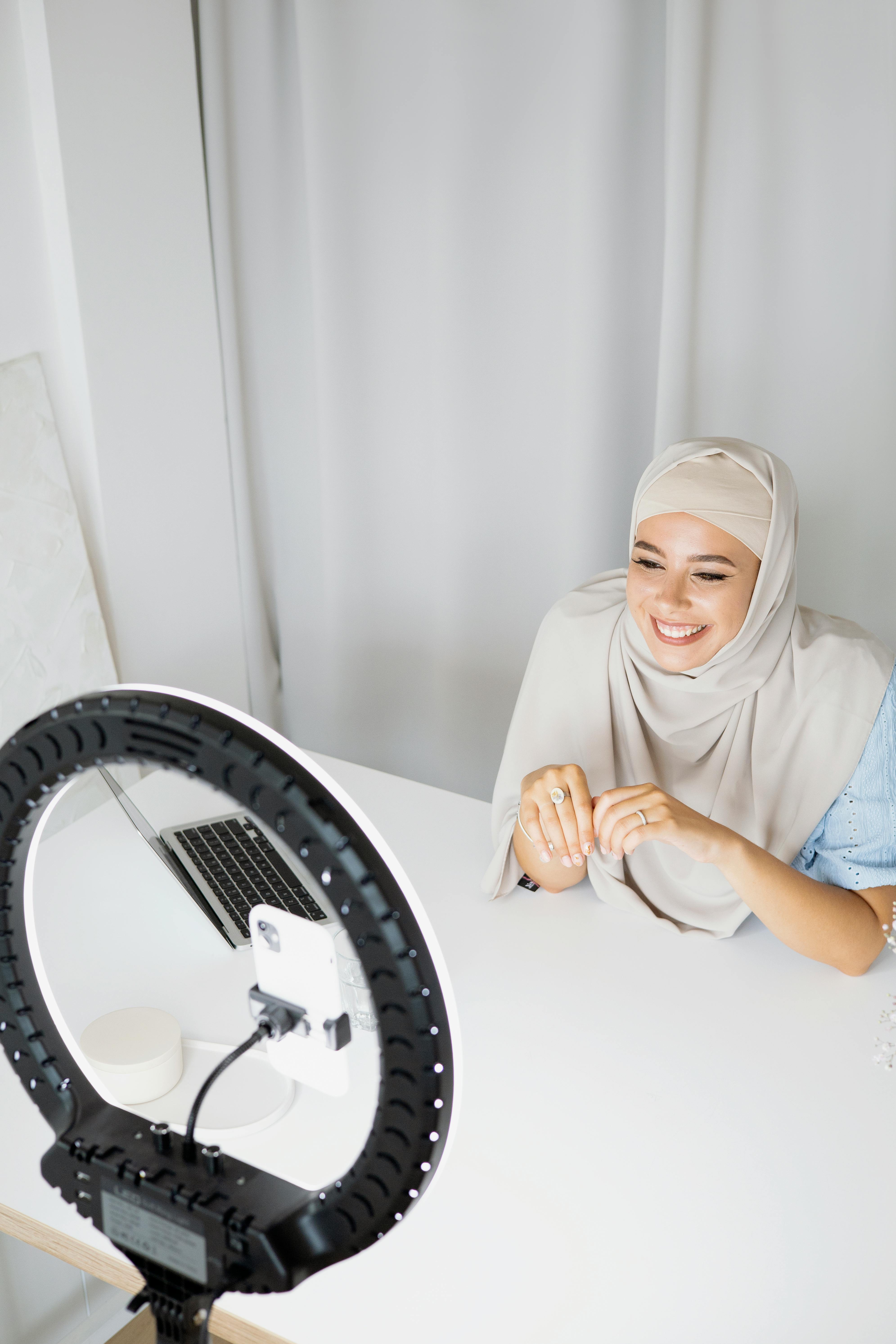 beautiful woman using a ring light for vlogging