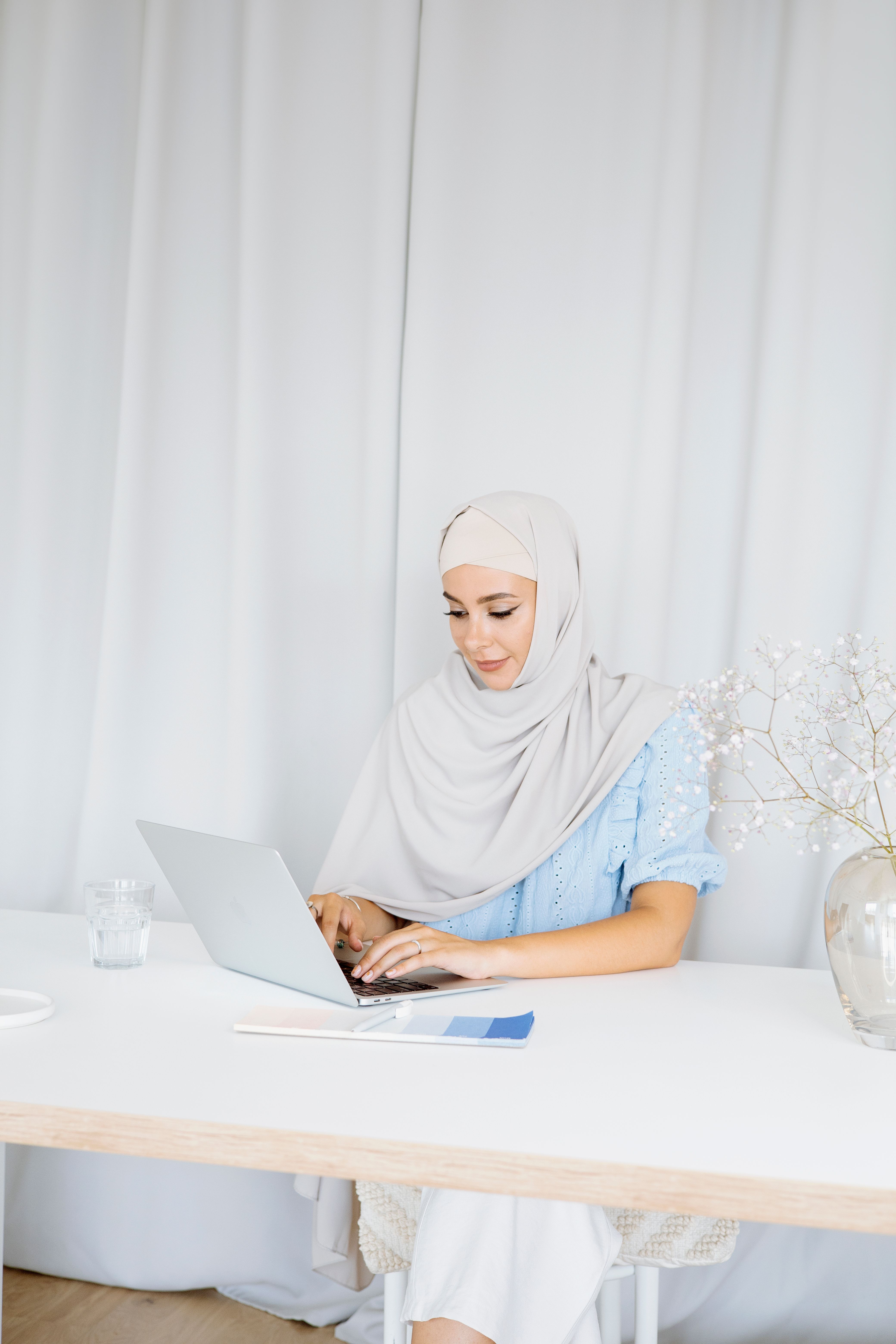 Beautiful Woman Wearing Hijab while Using a Laptop · Free Stock Photo