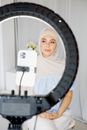 Woman in White Hijab Holding White Smartphone