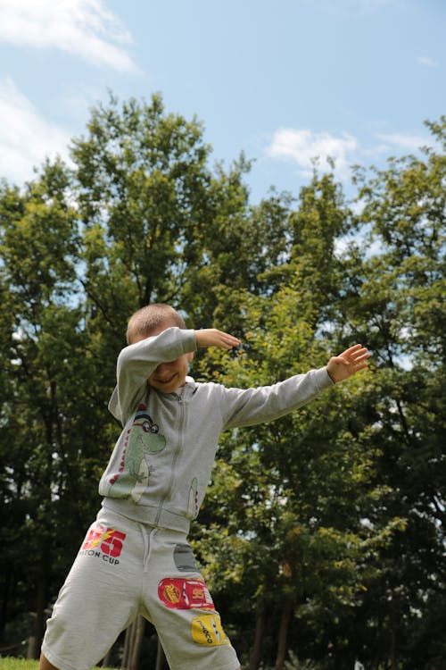 Boy in a Gray Jacket Dabbing