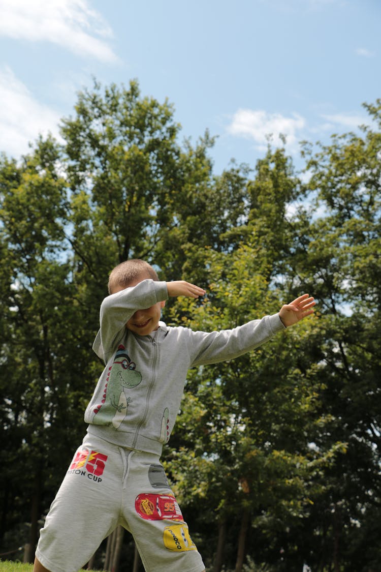 Boy In A Gray Jacket Dabbing