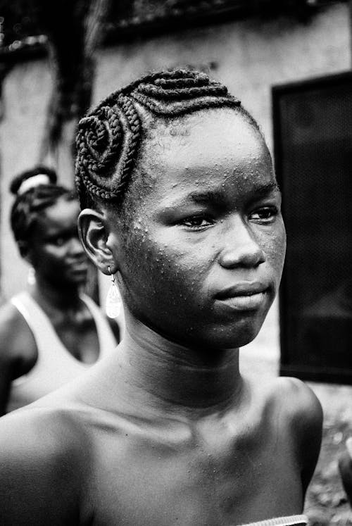 Grayscale Photo of a Person with Braided Hair