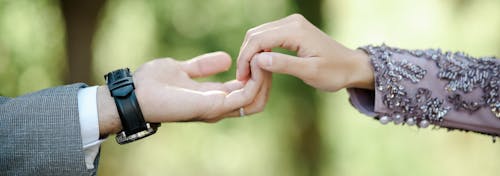 Wide Angle Shot of Couple Holding Hands