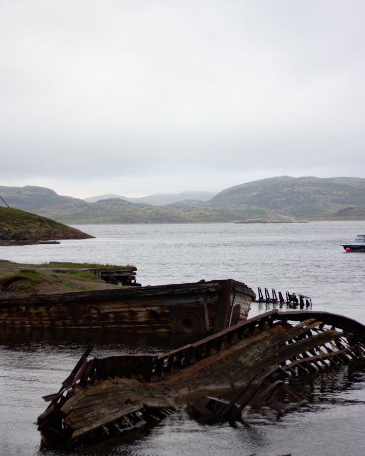 Broken Wooden Boats Floating On The River