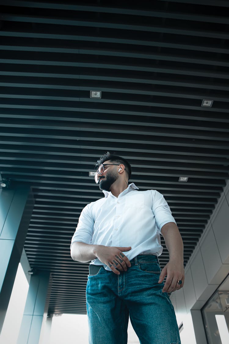 Low-Angle Shot Of A Man Wearing White Polo Shirt