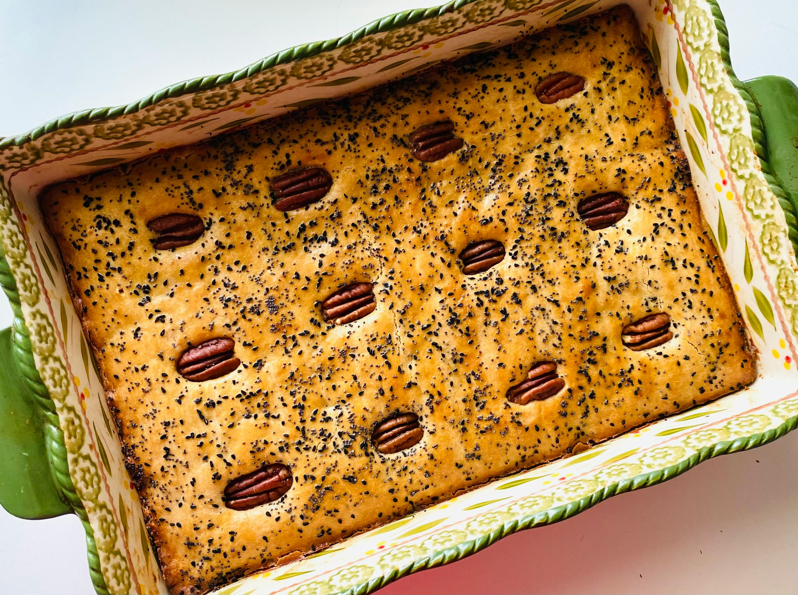 a close up shot of a bread with pecans