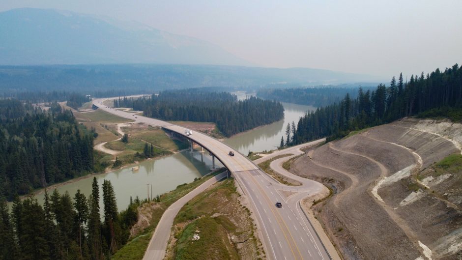 Ultimate The Sea to Sky Helicopter Sightseeing Tour Review: A Complete Guide to British Columbia's Most Spectacular Aerial Adventure Review 2026 - Aerial view of a highway bridge over a river in the scenic landscape of British Columbia, Canada.