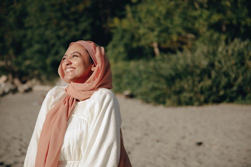 Free Beautiful Woman in White Dress and Pink Hijab Stock Photo