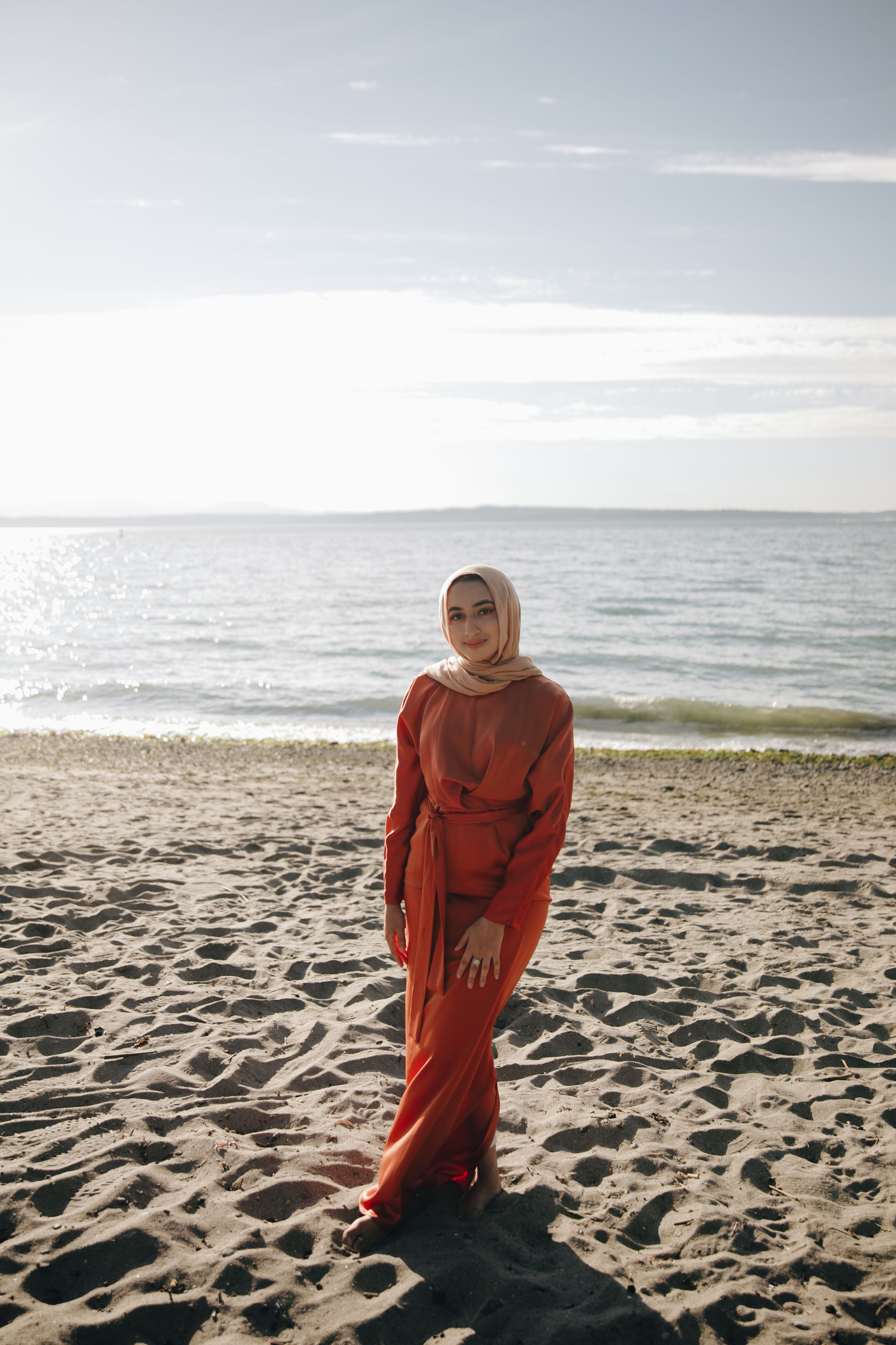 A Woman Standing on the Beach · Free Stock Photo