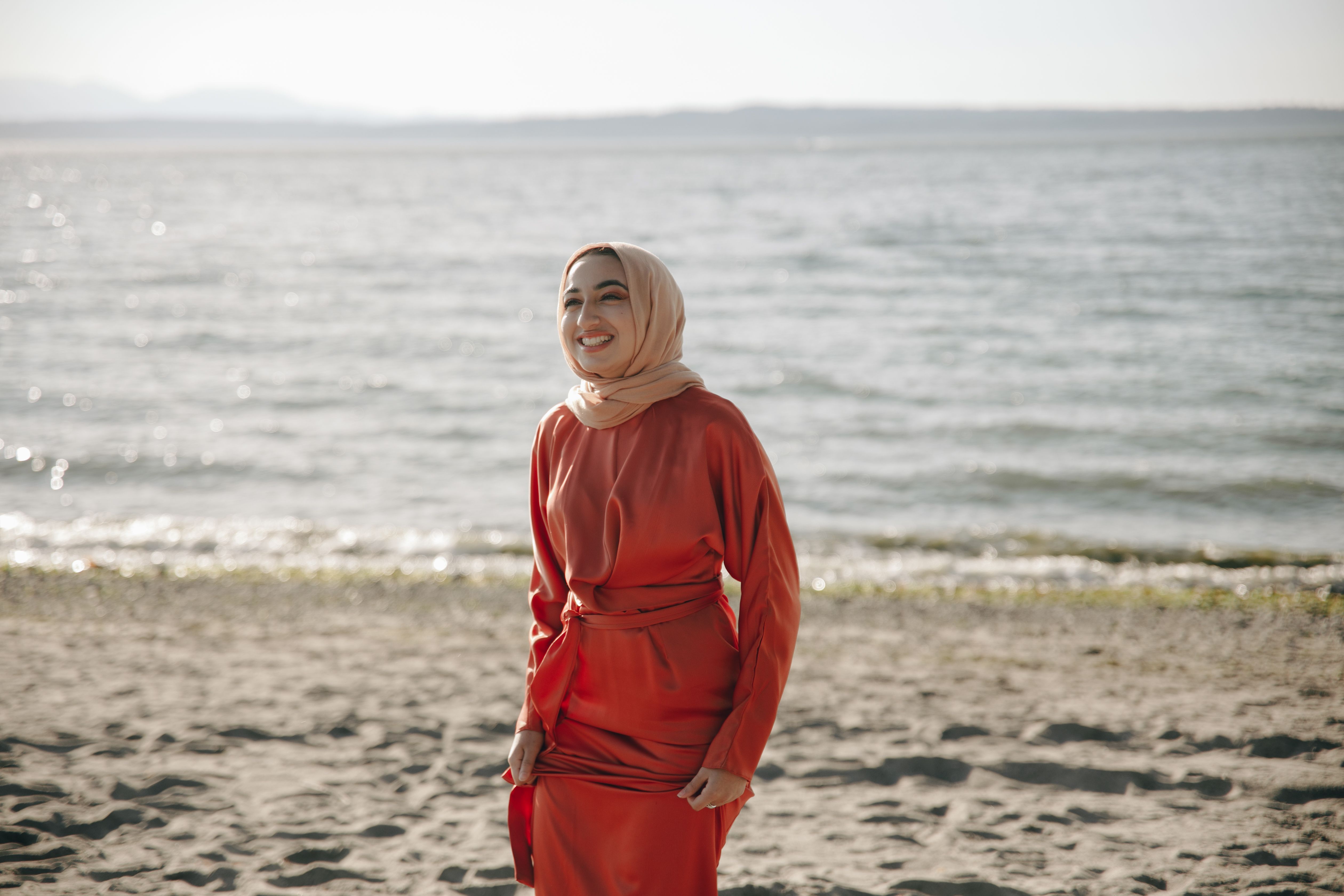 A Woman in Hijab Standing on the Beach · Free Stock Photo