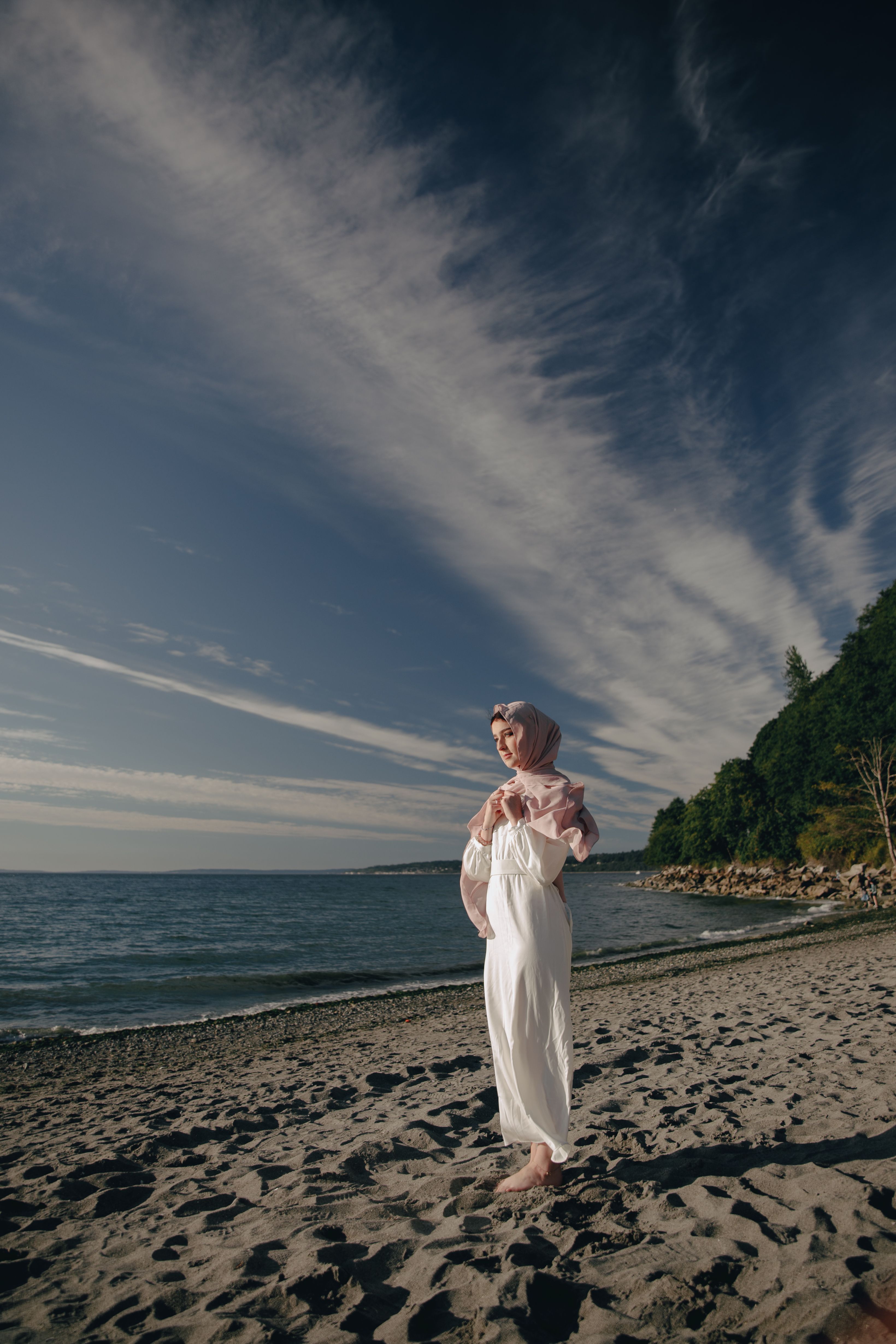 Woman in White Long Sleeve Dress Standing on Beach Shore · Free Stock Photo