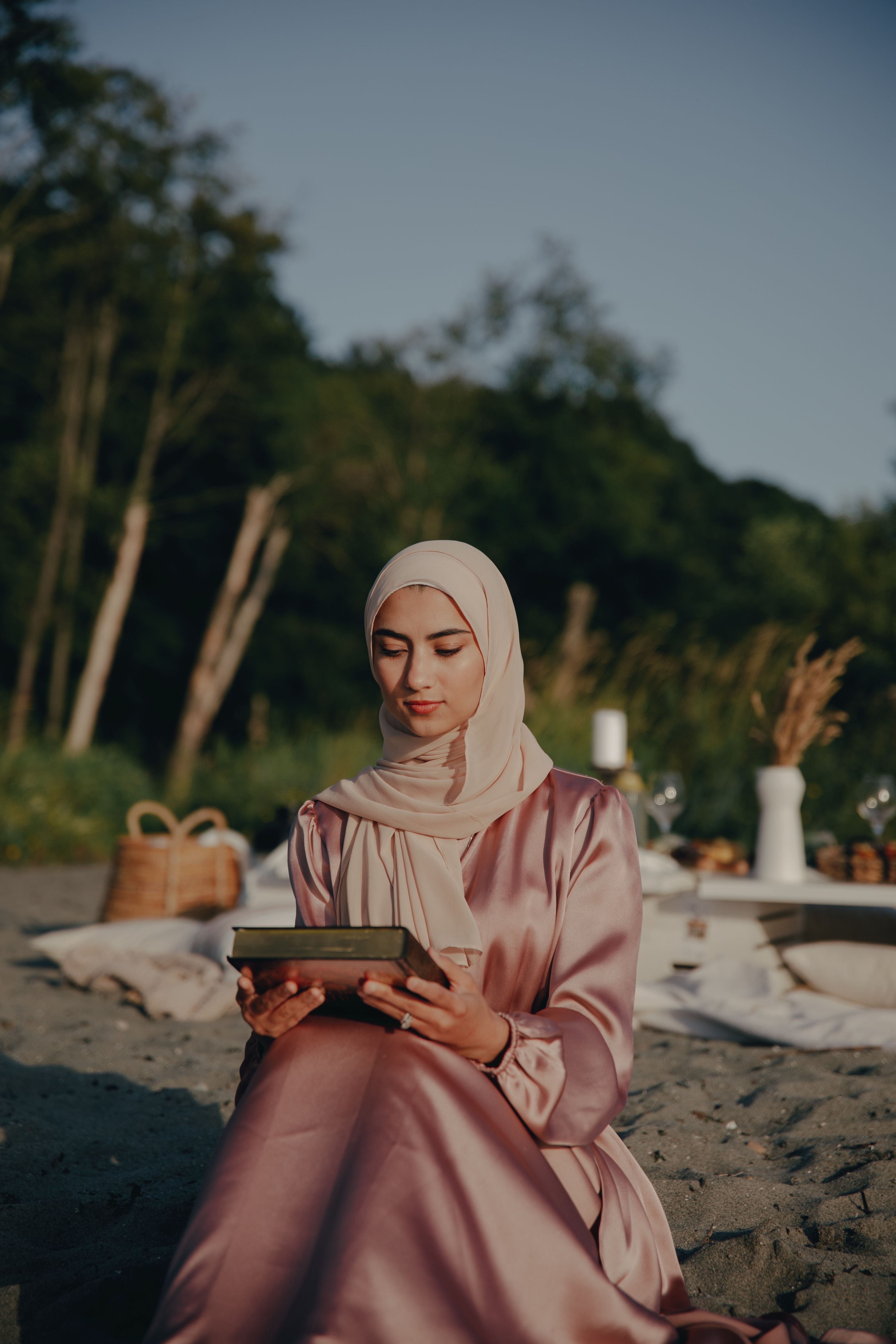 Woman in Brown Hijab Sitting on Brown Wooden Bench · Free Stock Photo