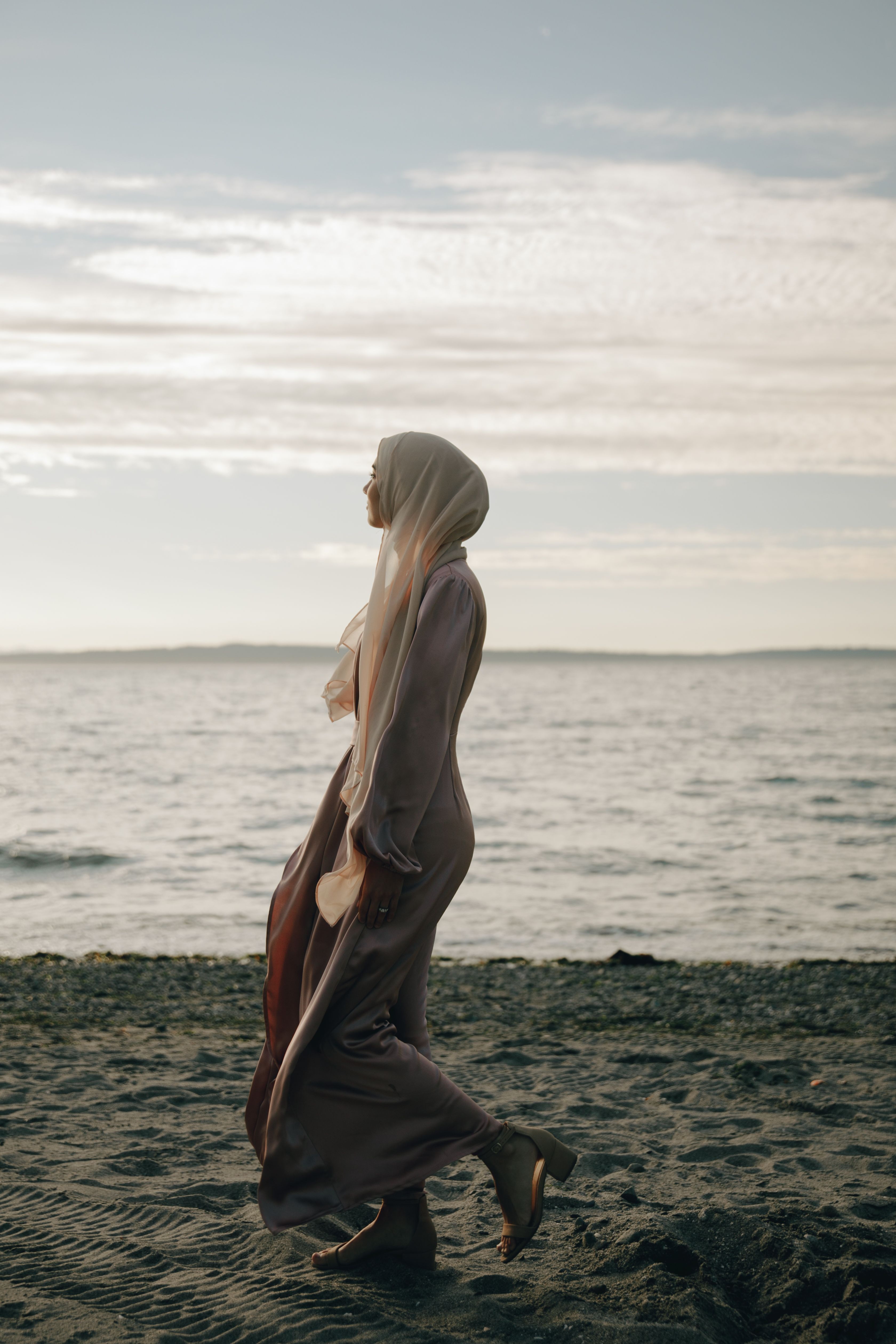 A Woman in a Hijab Walking at the Beach · Free Stock Photo