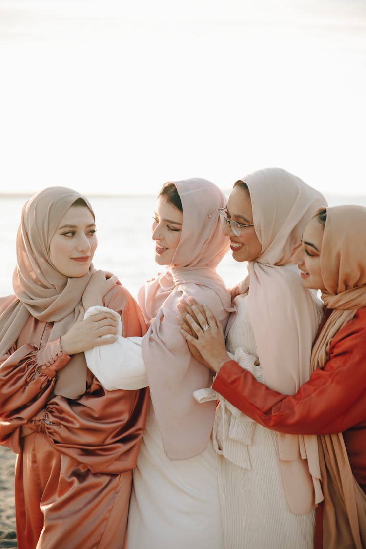 Group Of Women Wearing Traditional Dress And Hijabs