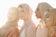 Woman in White Hijab Standing Near Body of Water