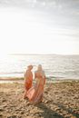 Woman in White Dress Standing on Beach