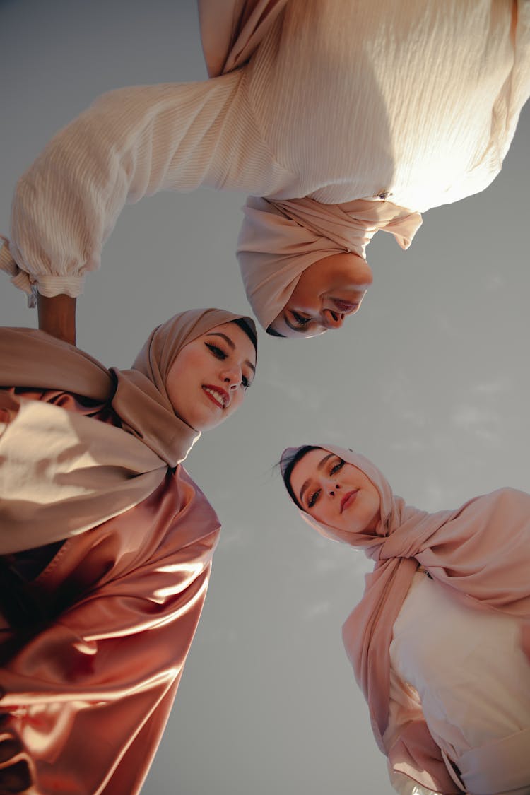 Three Women Wearing Abaya And Hijab