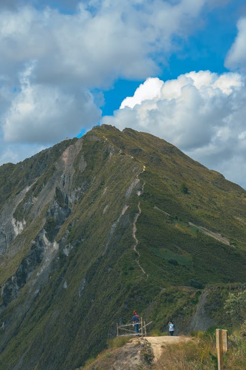 White Clouds above a Green Mountain