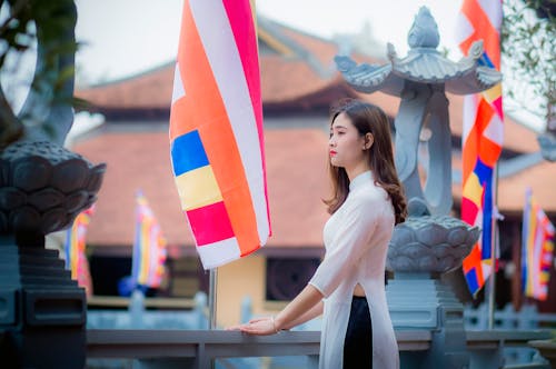 Woman Standing in Front of Banner