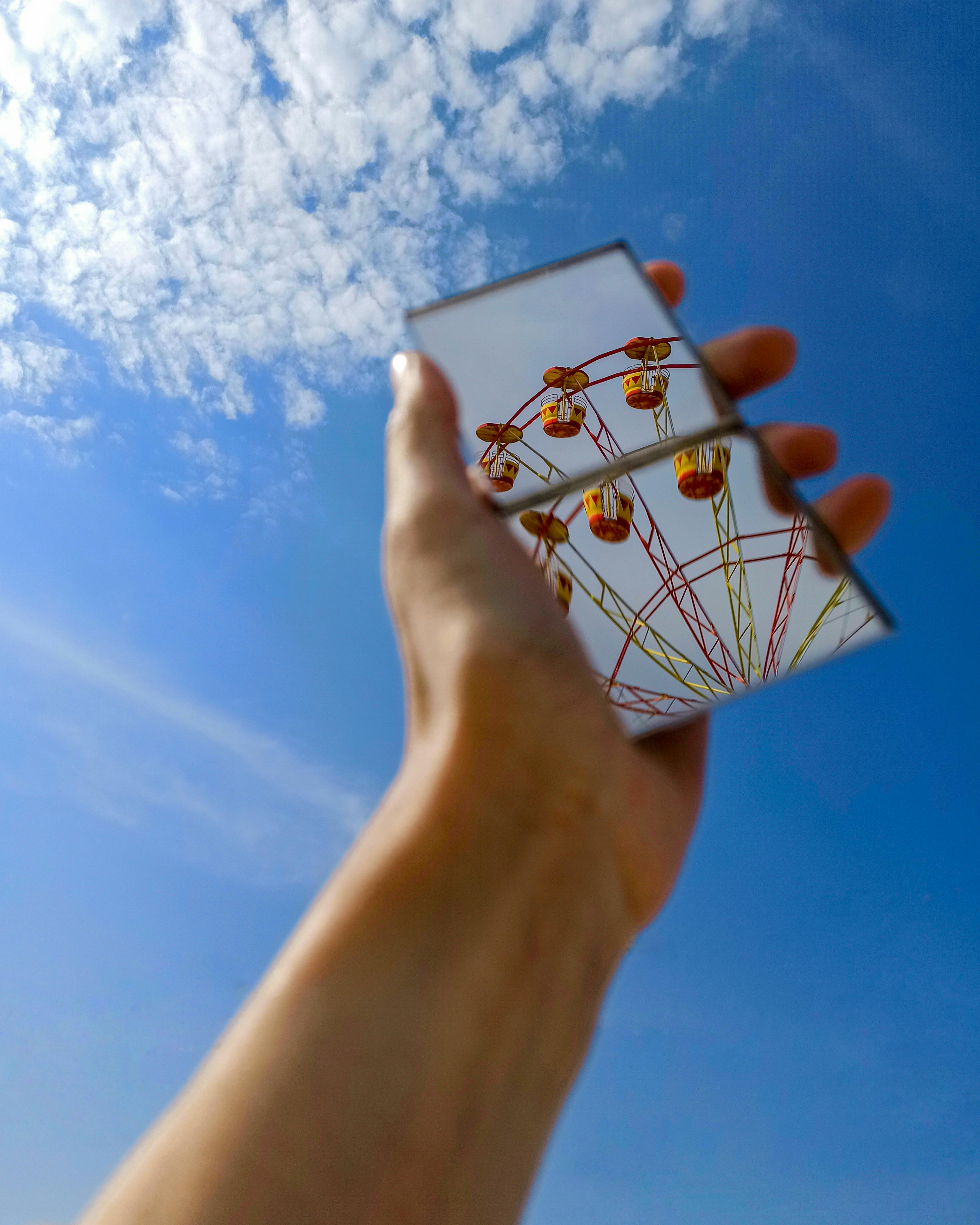 A Mirror Showing A Reflection Of A Ferris Wheel · Free Stock Photo