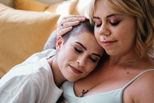 Free A tender moment showing affection between two women, illustrating love and connection. Stock Photo
