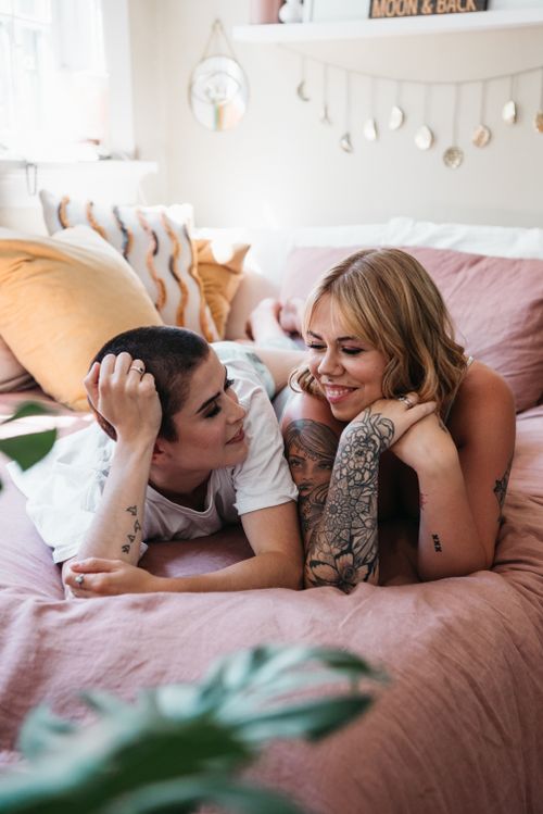 Free Lesbian couple enjoying a loving moment together indoors, expressing affection. Stock Photo