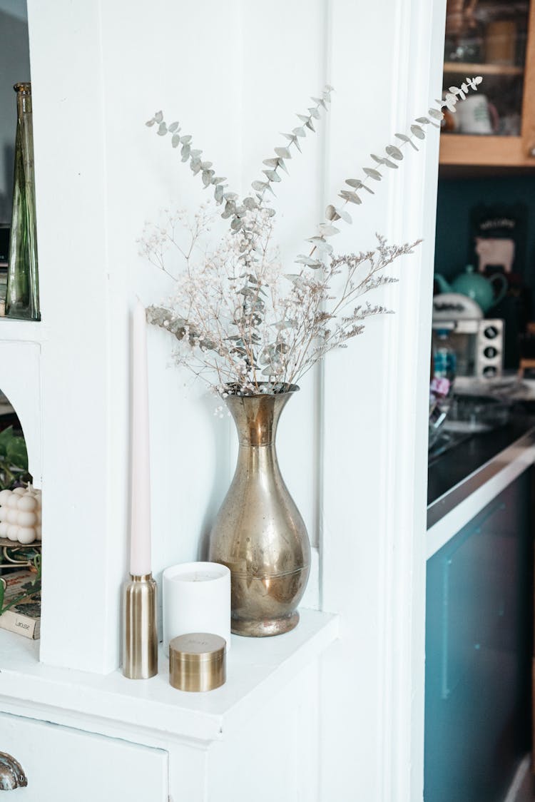 Dried Eucalyptus Leaves And Flowers On A Metal Vase