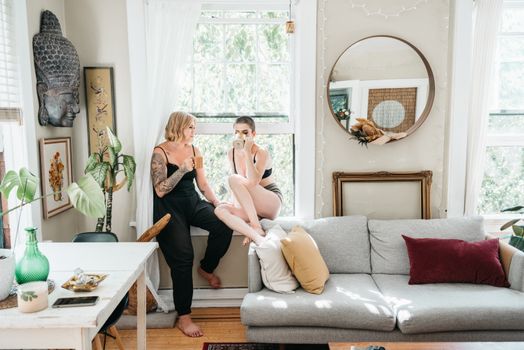 A warm and intimate scene of a couple enjoying coffee in a stylish living room setting.
