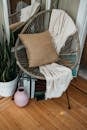 Brown Throw Pillow on Blue and White Armchair