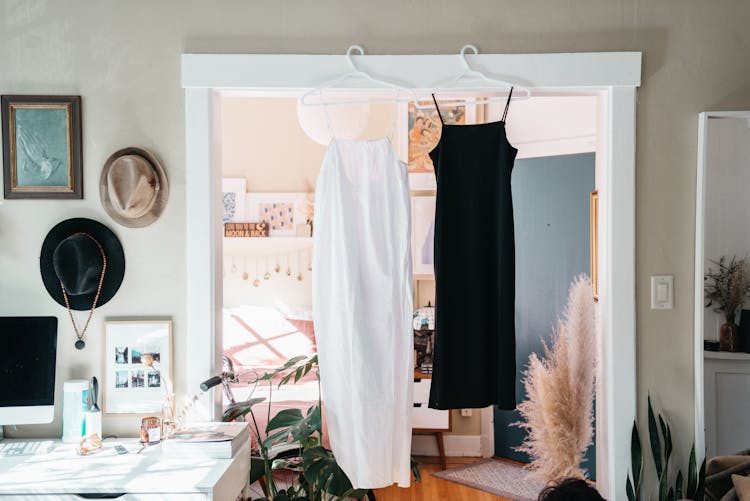 Home Interior With Hanging Dresses In A Doorway