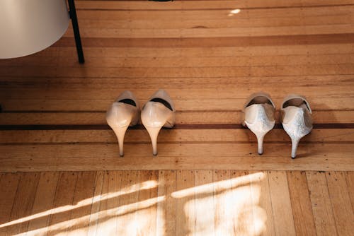 Free High Heels on a Wooden Floor Stock Photo