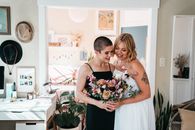 Women Holding Bouquet of Flowers Together