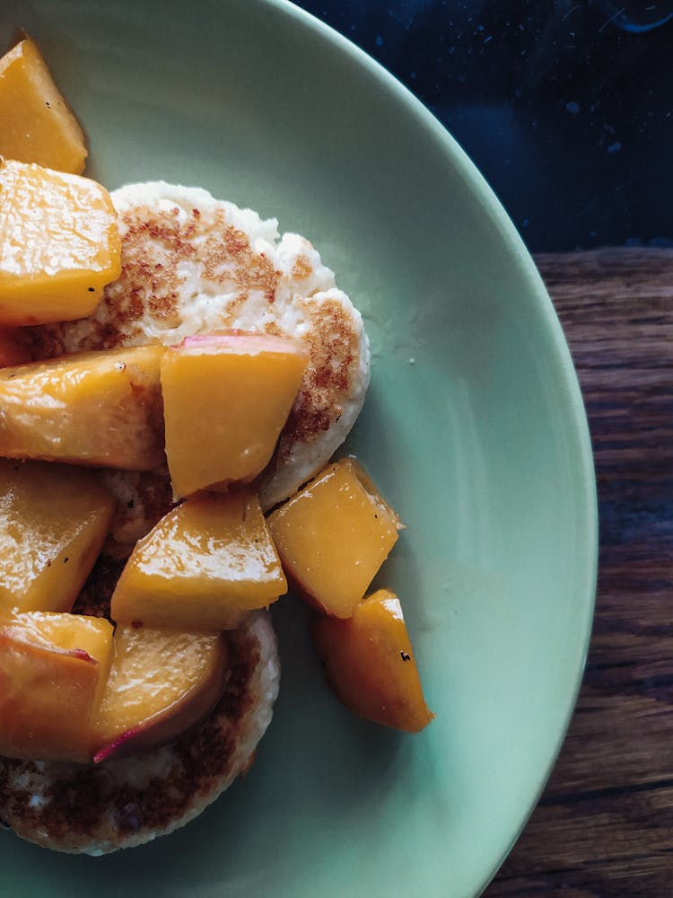 Mini Pancakes And Peach Slices On Ceramic Plate