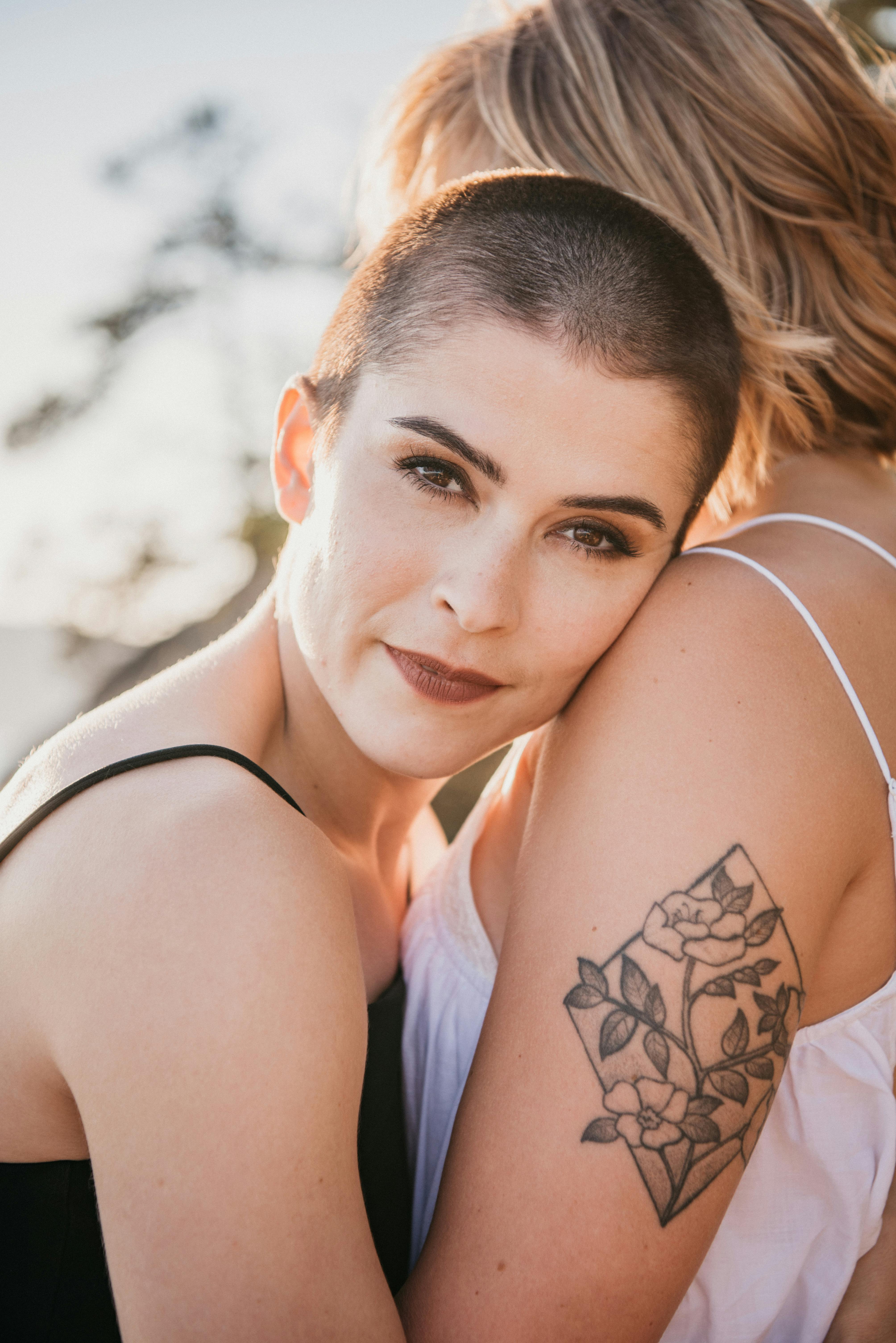 Woman Hugging Man with Tattoos · Free Stock Photo