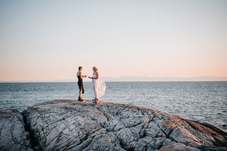 Two Girls Standing On The Big Rock