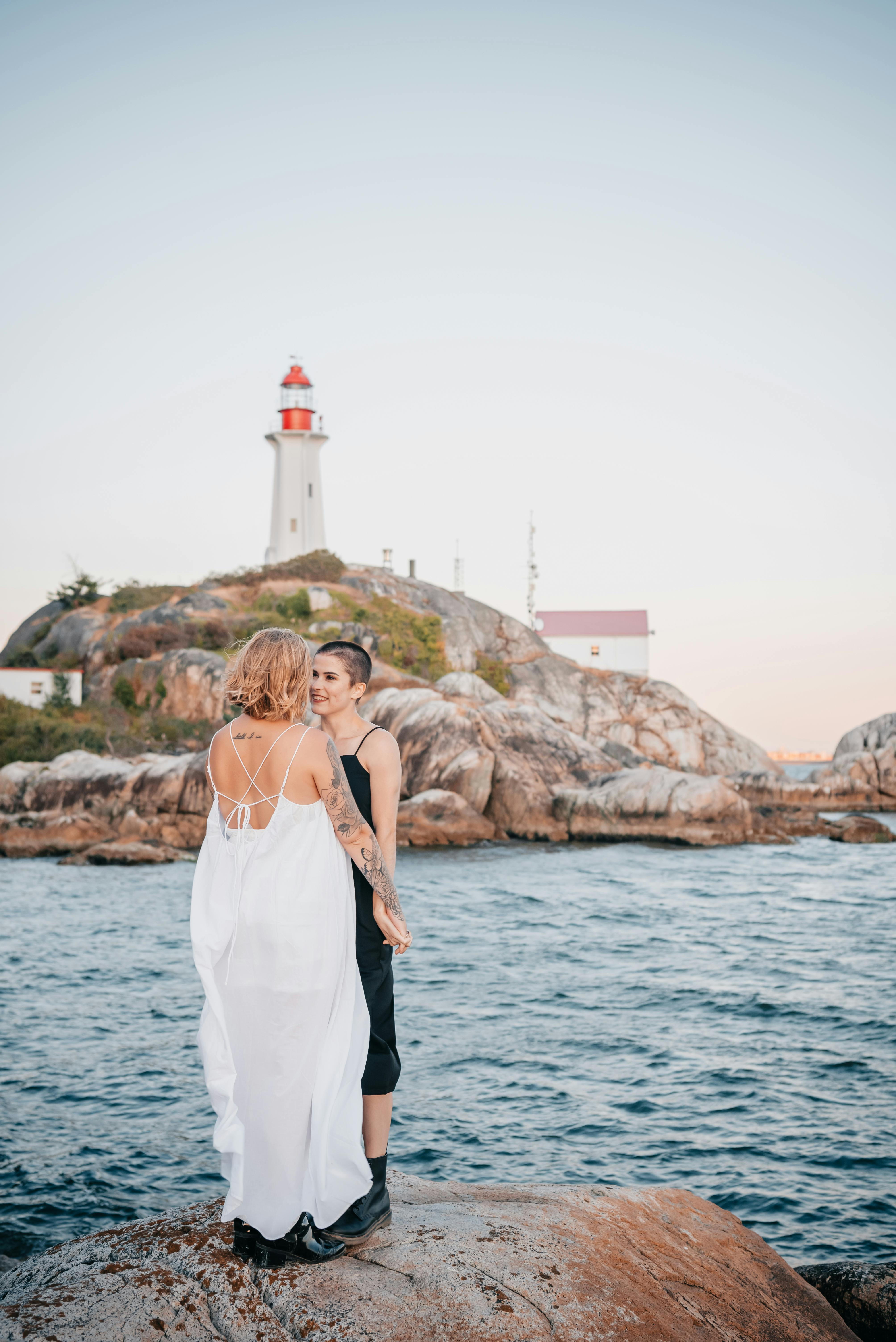 two women standing on the rock