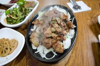 Close Up Photo of Meat on Sizzling Plate