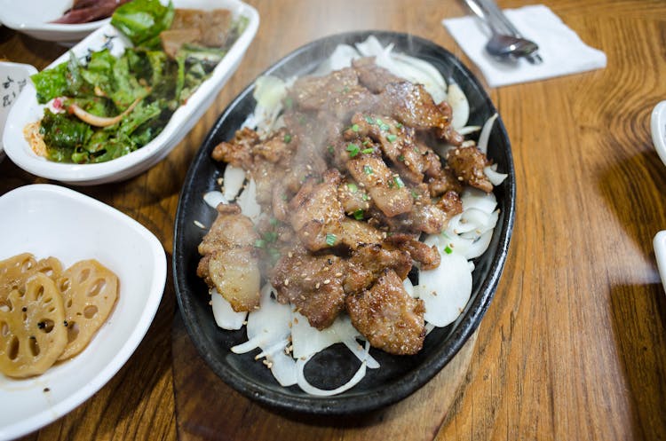 Close Up Photo Of Meat On Sizzling Plate