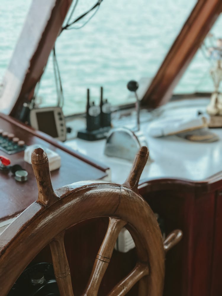 Close Up Of A Boat Interior With Wooden Rudder