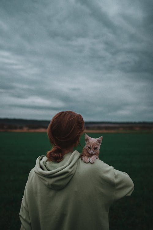 Woman Holding a Kitten