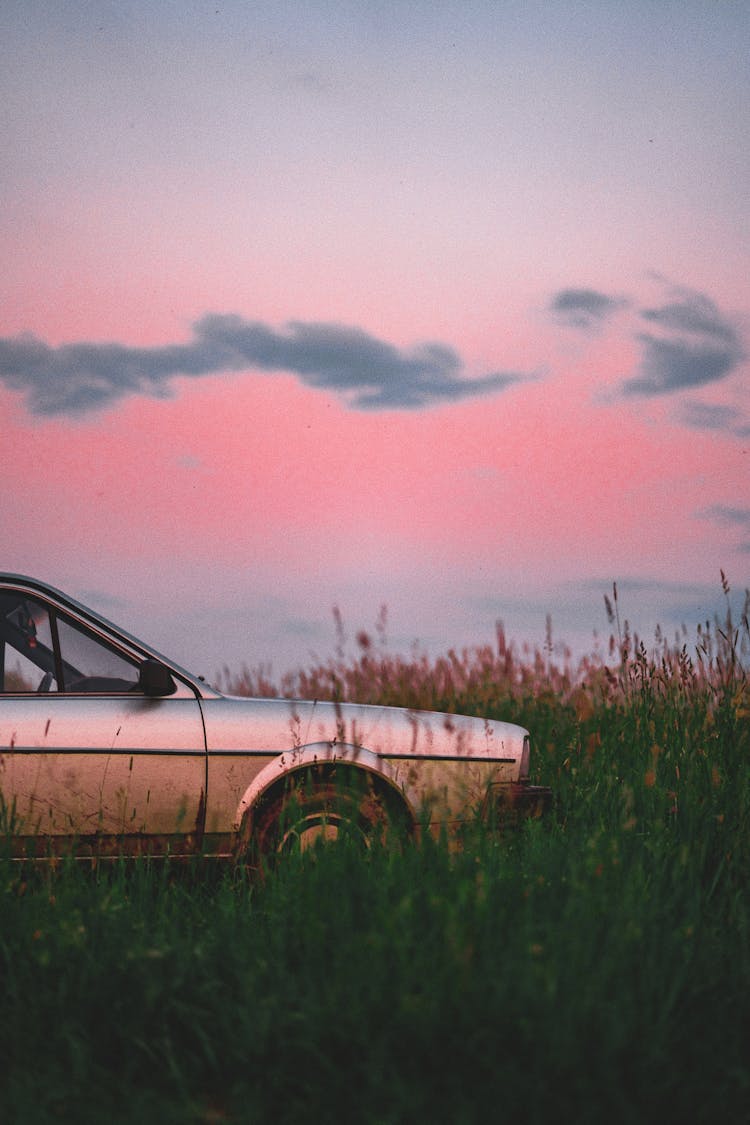 A Car Parked On A Grassy Area