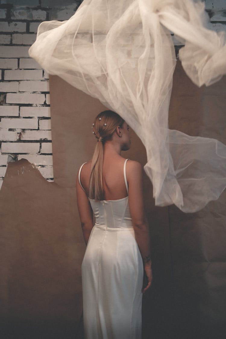 Photo Of A Woman In White Gown