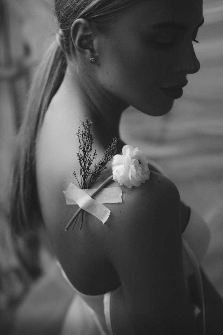 Flower Attached On Woman's Shoulder