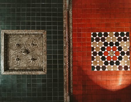 A Green and Red Ceramic Tiled Wall with Pentagon and Geometric Shapes