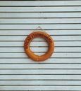 Life Ring Hanging on a Wooden Wall