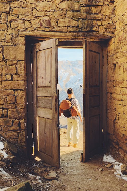 Wooden Doors Mounted on Stone Wall