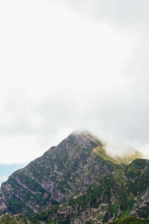 Rocky Mountain Under White Sky