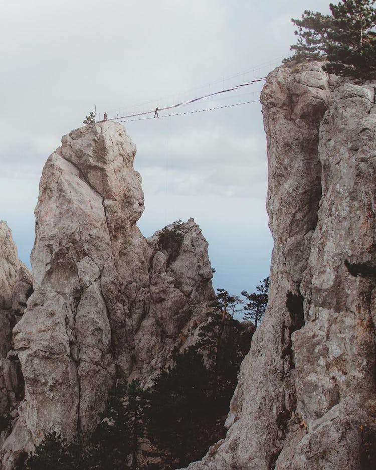 Hiker Walking On A Line Bridge On The Ai-Petri Mountain 